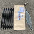 Set of black tent stakes, and silver tent pegs and a carrying bag with 'Glawning' branding on a concrete surface.